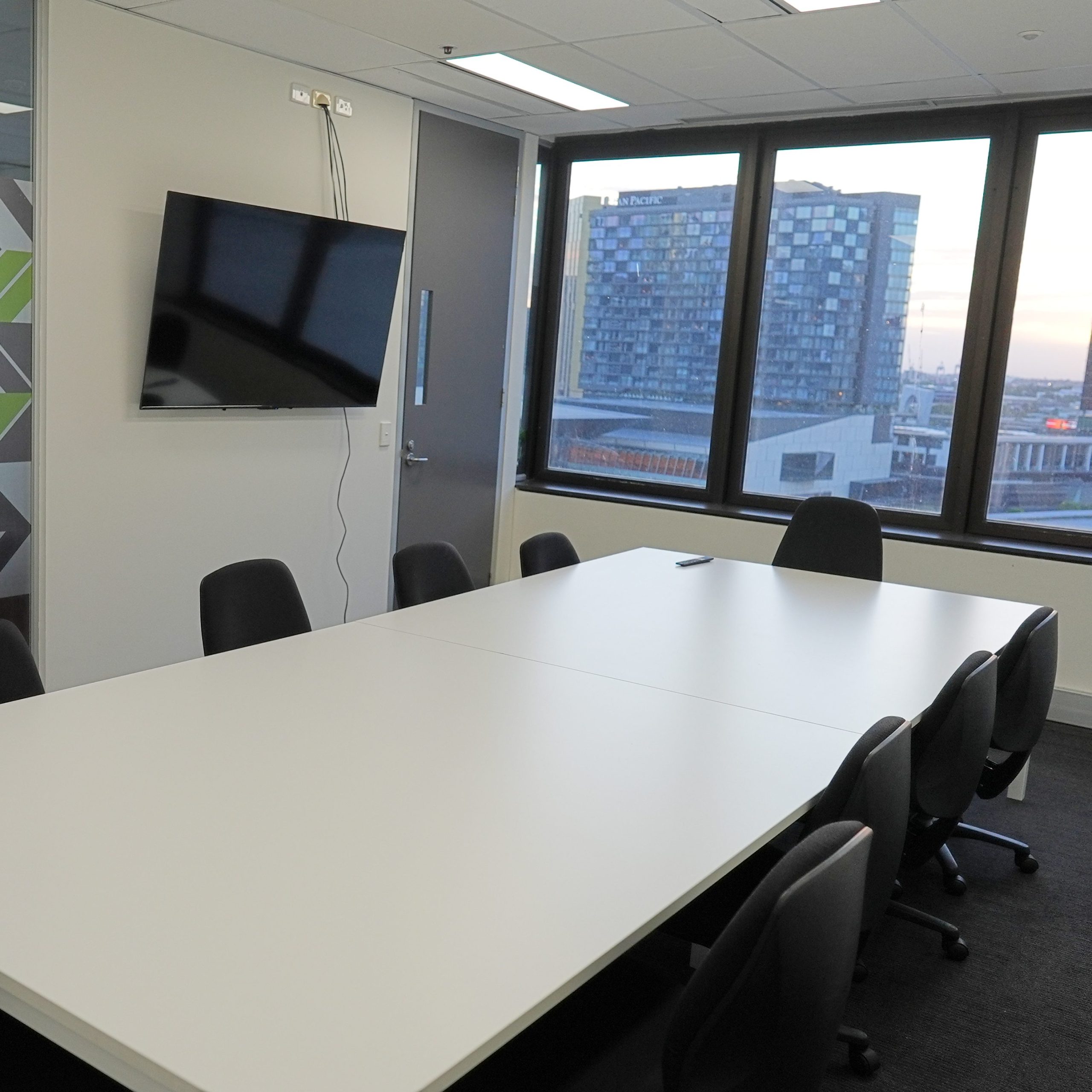 Modern meeting room within Melbourne office space with city views