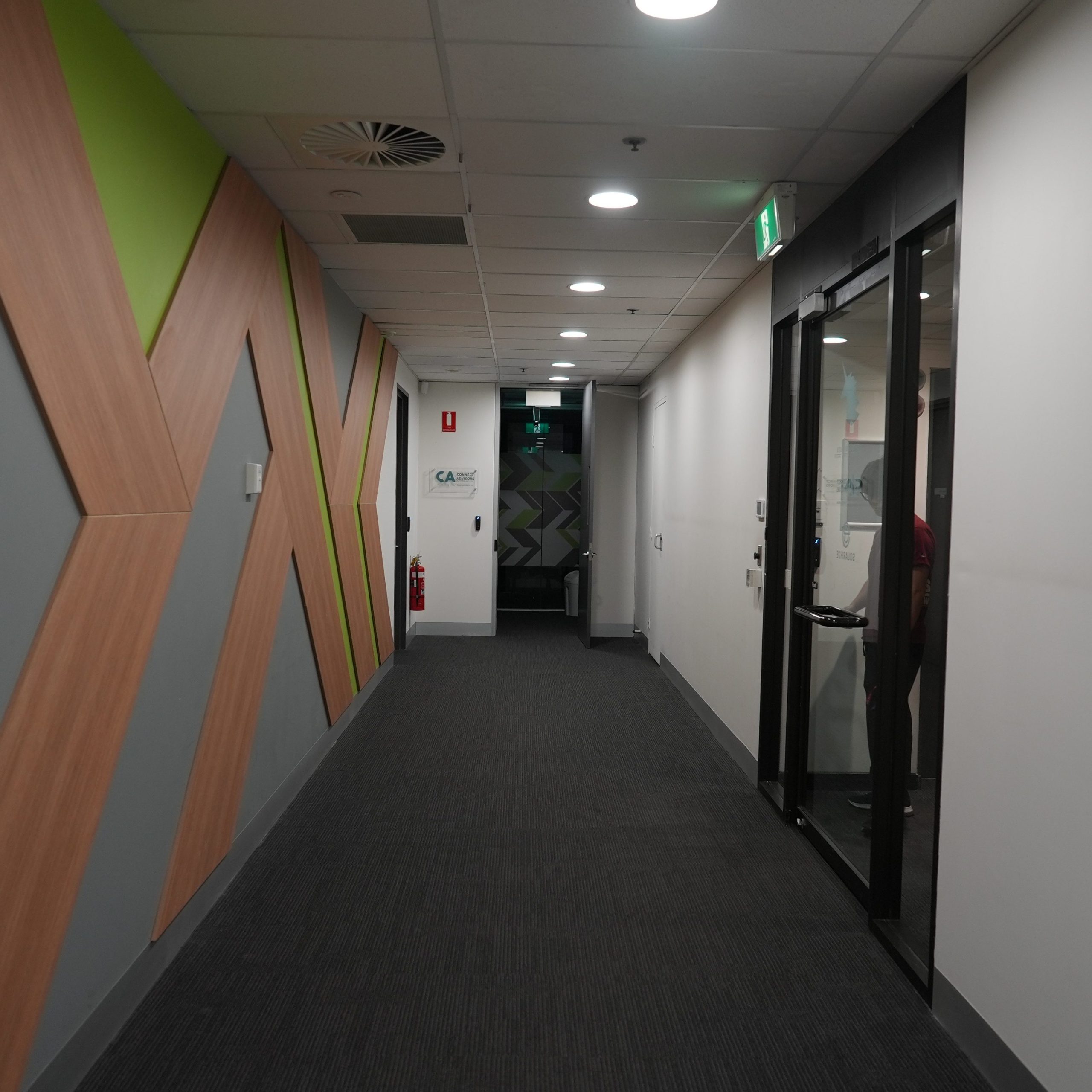Internal hallway and access corridor within Melbourne office space